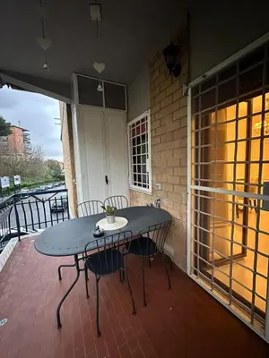 a table and chairs sitting on a patio at A casa di Lù in Rome