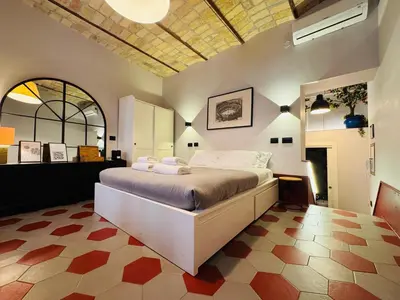 a bedroom with a large bed in a room at Hexa in Rome