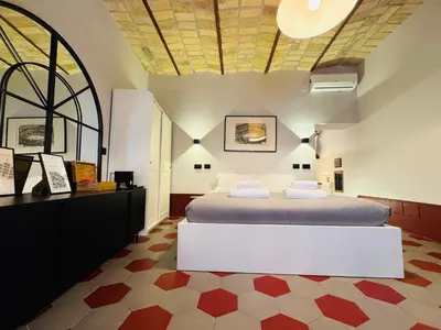 a bedroom with a large bed in a room at Hexa in Rome
