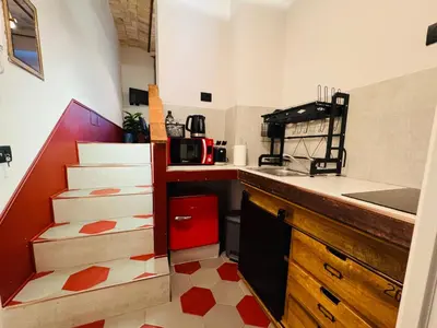 a small kitchen with a sink and some boxes at Hexa in Rome