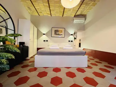 a bedroom with a bed in a room with at Hexa in Rome