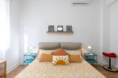 a bedroom with a bed with pillows on it at Gemelli Apartment in Rome
