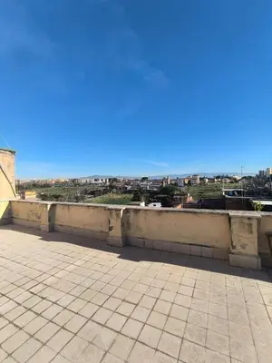 a view of a city from the roof of a building at Cozy Room in Rome
