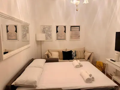 a bedroom with a bed with two towels on it at Casa Roma in Rome