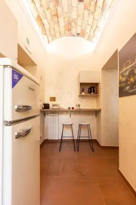 a kitchen with a ceiling with a skylight at Albio House - Nido Per 6PPL 3BTH in Rome