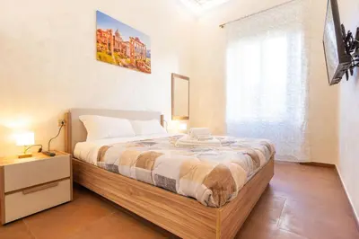 a bedroom with a large bed and a window at Albio House - Nido Per 6PPL 3BTH in Rome