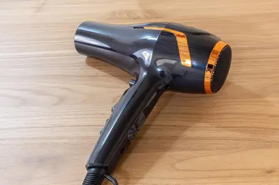 a hair dryer sitting on top of a wooden table at Albio House - Nido Per 6PPL 3BTH in Rome