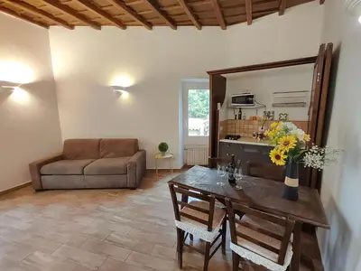 a living room with a table and a couch at House Moro in Rome