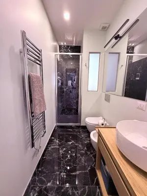 a bathroom with two sinks and a toilet and a shower at Spacious Apartment with Outdoor Terrace near Vatican - Casa Vacanze Romane in Rome