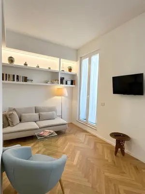 a living room with a couch and a tv at Spacious Apartment with Outdoor Terrace near Vatican - Casa Vacanze Romane in Rome