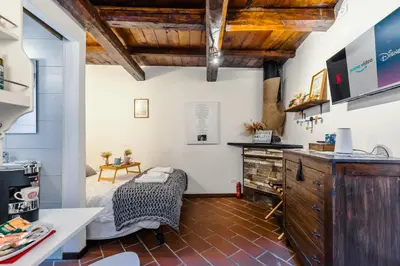 a kitchen with a table and a chair in a room at 