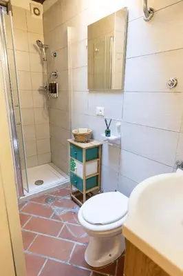 a bathroom with a toilet and a shower and a sink at 