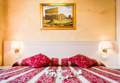 a bedroom with a bed with a painting on the wall at Domus Trevi in Rome
