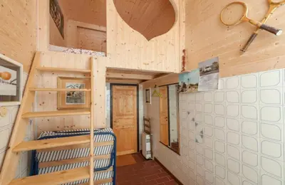 a room with a bunk bed in a tiny house at Qiyuan Hotel in Rome