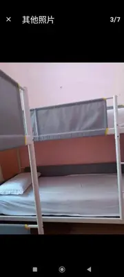 a bunk bed with a ladder on top of it at Qiyuan Hotel in Rome