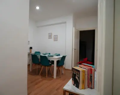 a room with a table and chairs and a dining room at Via Lattea Vatican Apartment - Family friendly in Rome