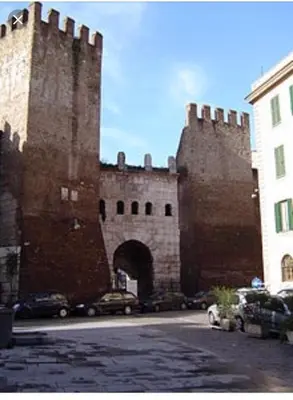 a large castle with a gate and a building at White Flat Termini in Rome