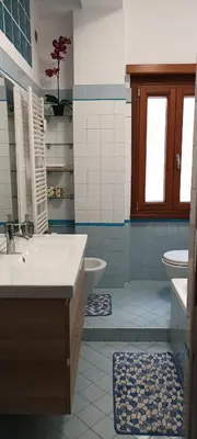 a bathroom with a sink and a tub and a toilet at Leila Stazione Tiburtina 10 minuti dal Coloseo in Rome