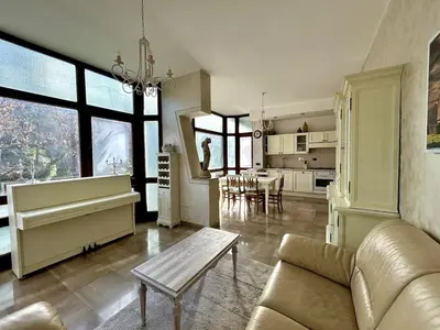 a living room with a couch and a table at Da Elisa e Davide House in Rome