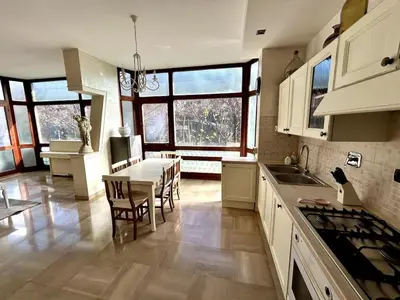 a kitchen with a table and a dining room at Da Elisa e Davide House in Rome