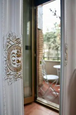 a door with a mirror in a room at Da Elisa e Davide House in Rome