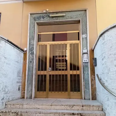 an entrance to a building with a gate at Appartamento Vaticano Metro A in Rome