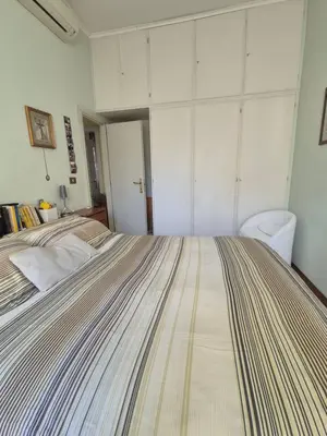 a bedroom with a large bed in a room at La casa di Giulia in Rome