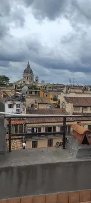 a view of a city from the roof of a building at Exclusive Flat Piazza di Spagna in Rome