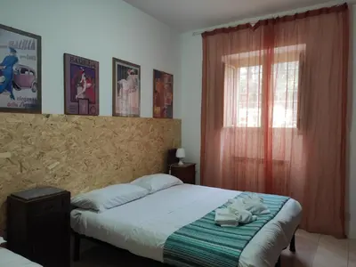 a bedroom with a bed with towels on it at Fabio's Home Gemelli in Rome