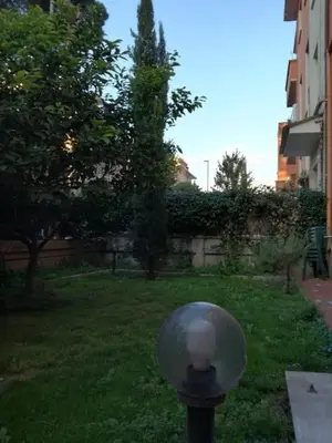 a street light with a glass dome on a pole in a yard at Fabio's Home Gemelli in Rome