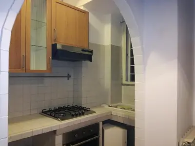 a kitchen with a stove and a sink at Fabio's Home Gemelli in Rome