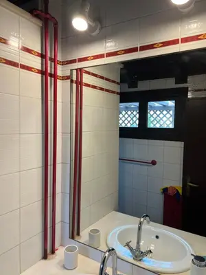 a bathroom with a sink and a mirror at EXCLUSIVE House OTTAVIANO in Rome