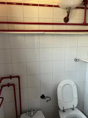 a bathroom with a toilet and a bidet at EXCLUSIVE House OTTAVIANO in Rome