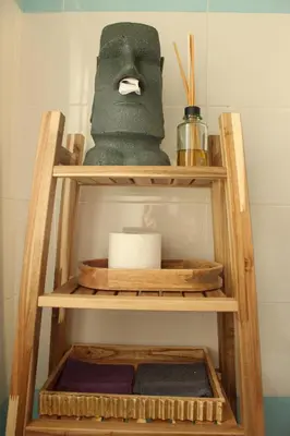 a wooden shelf with a towel and a roll of towels at Wood Apartment - Rome Battistini in Rome
