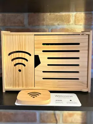 a wooden box sitting on a table with a router at Wood Apartment - Rome Battistini in Rome