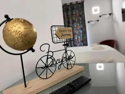 a statue of a bicycle on a table next to a bed at Trastevere alla Lungaretta, Rome in Rome