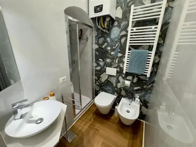 a bathroom with a sink and a toilet at Trastevere alla Lungaretta, Rome in Rome