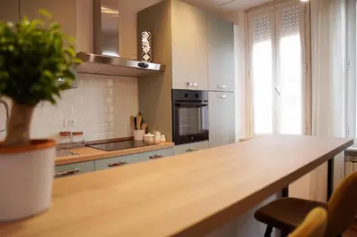 a kitchen with a wooden counter top in a room at Dolce Roma Apartment in Rome