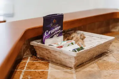 a basket under a table with a bag of candy at Daniele Flat - Ospedale Gemelli - Metro Battistini in Rome