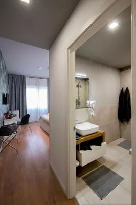 a bathroom with a sink and a mirror at Guest House VB Luxury Suites in Rome