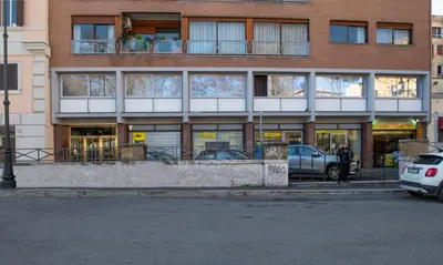 a building with cars parked in front of it at Guest House VB Luxury Suites in Rome