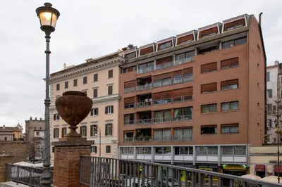 a building with a street light in front of it at Guest House VB Luxury Suites in Rome