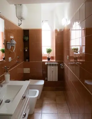 a bathroom with a toilet and a sink at Aunt's Vatican Home in Rome