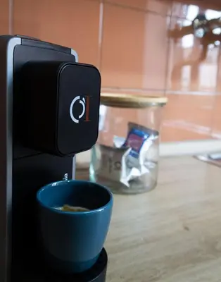 a coffee machine with a cup of coffee at Aunt's Vatican Home in Rome