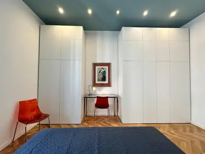 a bedroom with a bed and a table and chairs at Bright House appartamento Roma in Rome