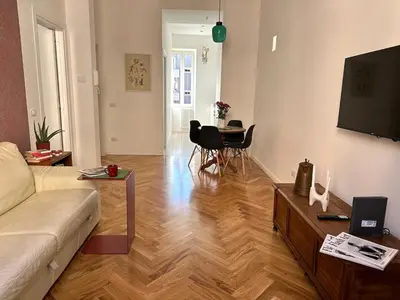 a living room with a couch and a table at Bright House appartamento Roma in Rome