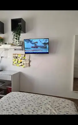 a wall with a tv on a white wall at Room Etruria Center Rome in Rome