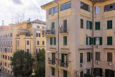 a group of tall buildings in a city at The Magic of San Peter in the Heart of Rome in Rome