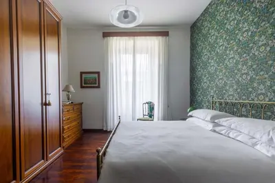 a bedroom with a large bed and a window at The Magic of San Peter in the Heart of Rome in Rome