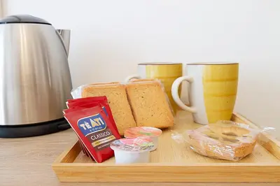 a cutting board with bread and condiments on a table at Vatican Cipro Guest House in Rome
